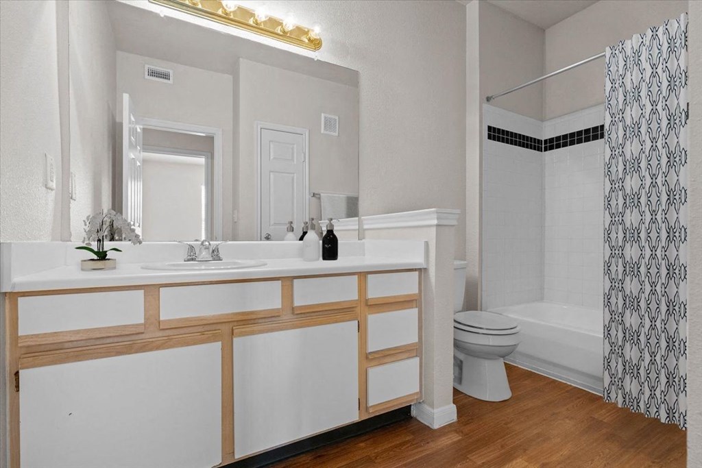 a bathroom with a toilet and a sink and a mirror  at Crescent, Kansas, 66219