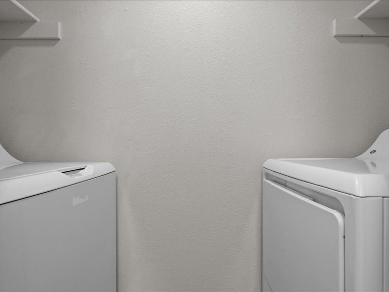 a white washer and dryer in a white room at Highland Park Apartment Homes, Kansas, 66214