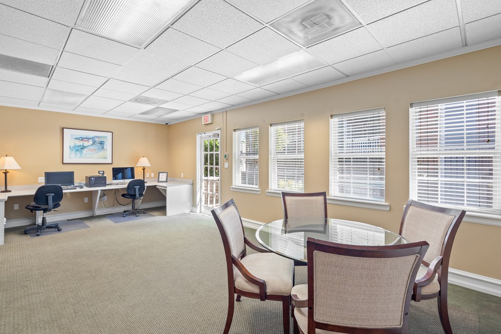 a room with a table and chairs at Stonebriar Apartments, Overland Park