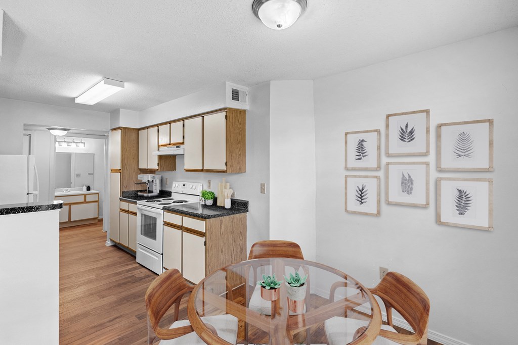 a kitchen and dining area in a 555 waverly unitat Stonebriar Apartments, Kansas, 66213