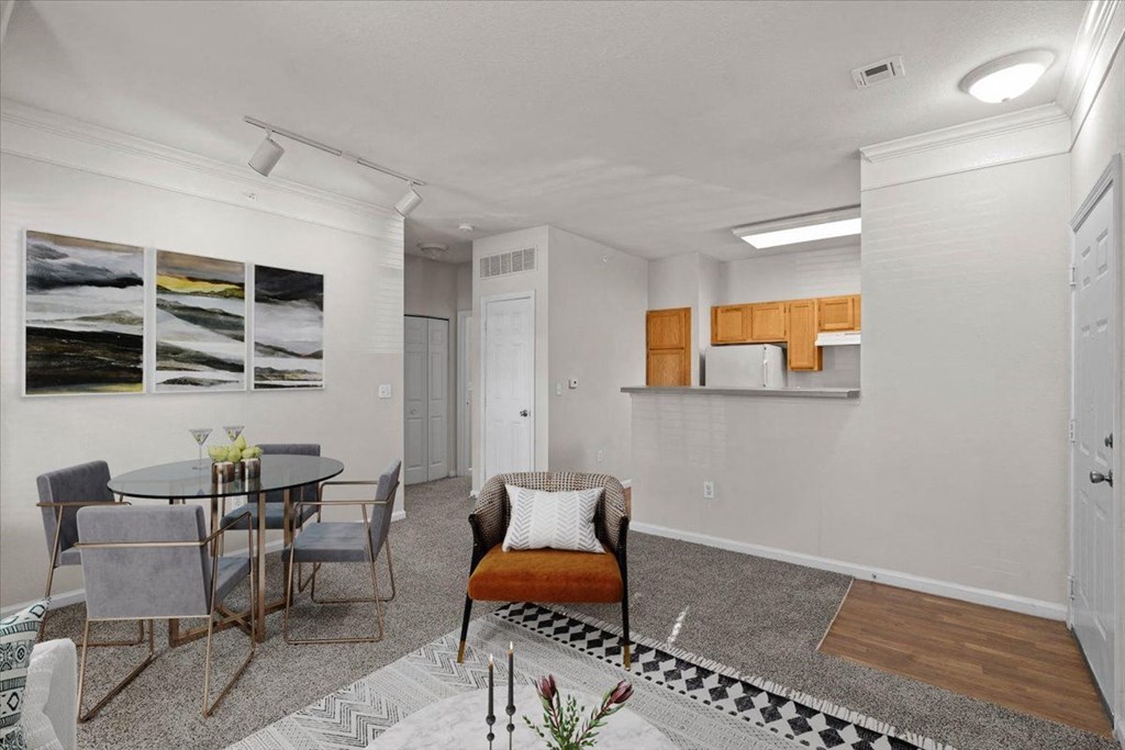 A dining room with a table and chairs. at Somerset Oaks Apartment Homes, Olathe