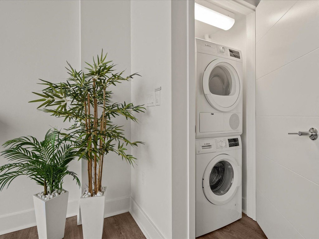 a white washer and dryer at Sky On Main Apartments, Missouri City, Missouri