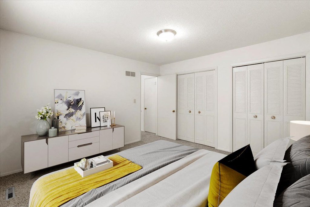 Bedroom with a comfortable bed  at Louisburg Square Apartments & Townhomes, Kansas, 66212