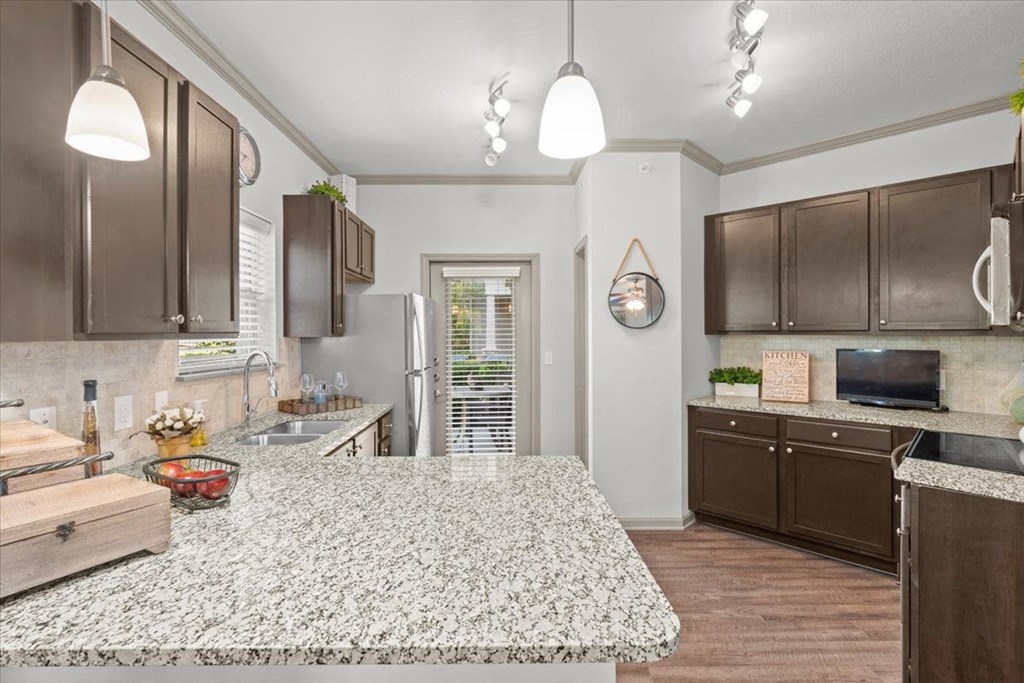 a kitchen with a large island in the middle of it