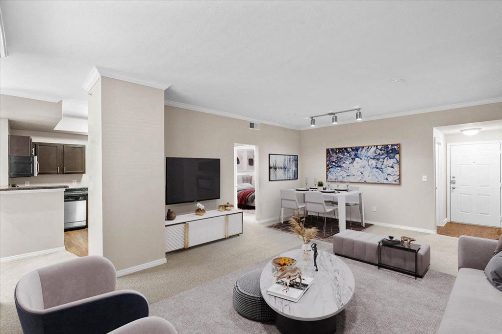 a living room with a couch and a table at The Clairborne Apartment Homes, Grand Prairie, TX, 75050