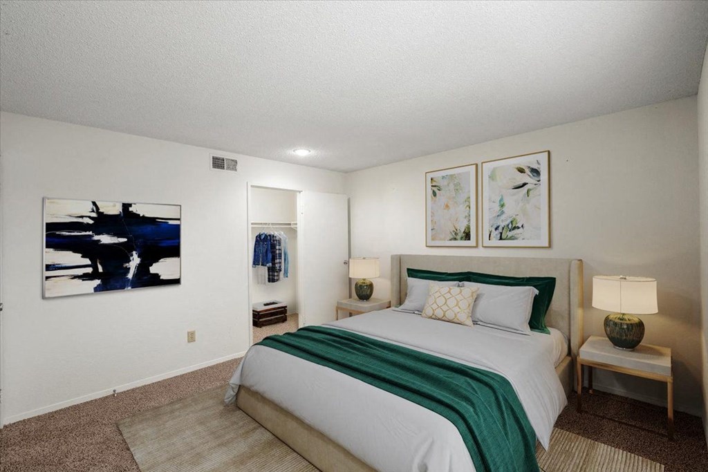 A primary bedroom with a large walk-in closet at Bristol Pointe Apartment Homes, Olathe, KS, 66062