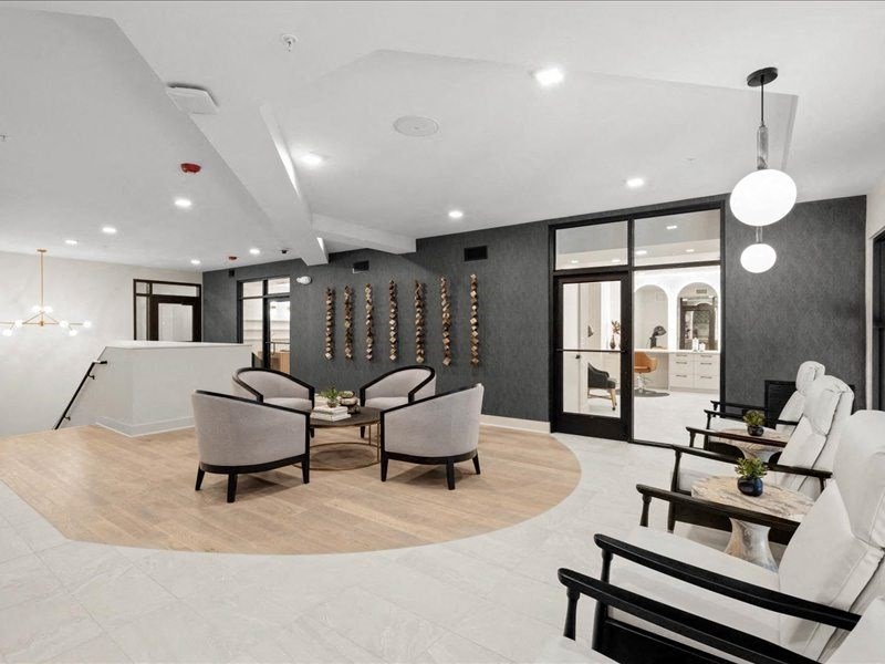 a dining room with a table and chairs in a lobby