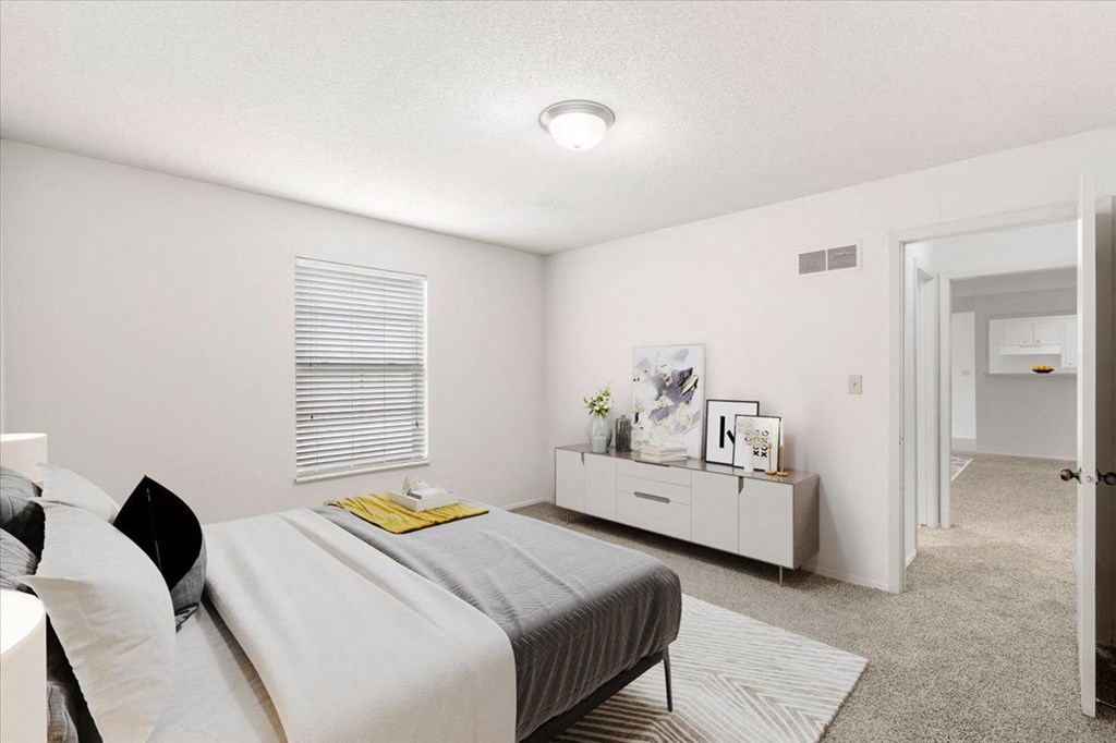 Bedroom with window  at Louisburg Square Apartments & Townhomes, Kansas