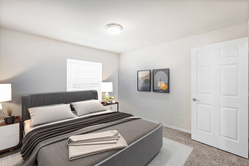 a bedroom with a bed and two nightstandsat Stonebriar Woods Apartments, Kansas, 66213