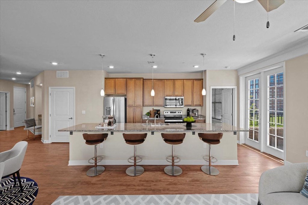 a kitchen and living room with a large island
