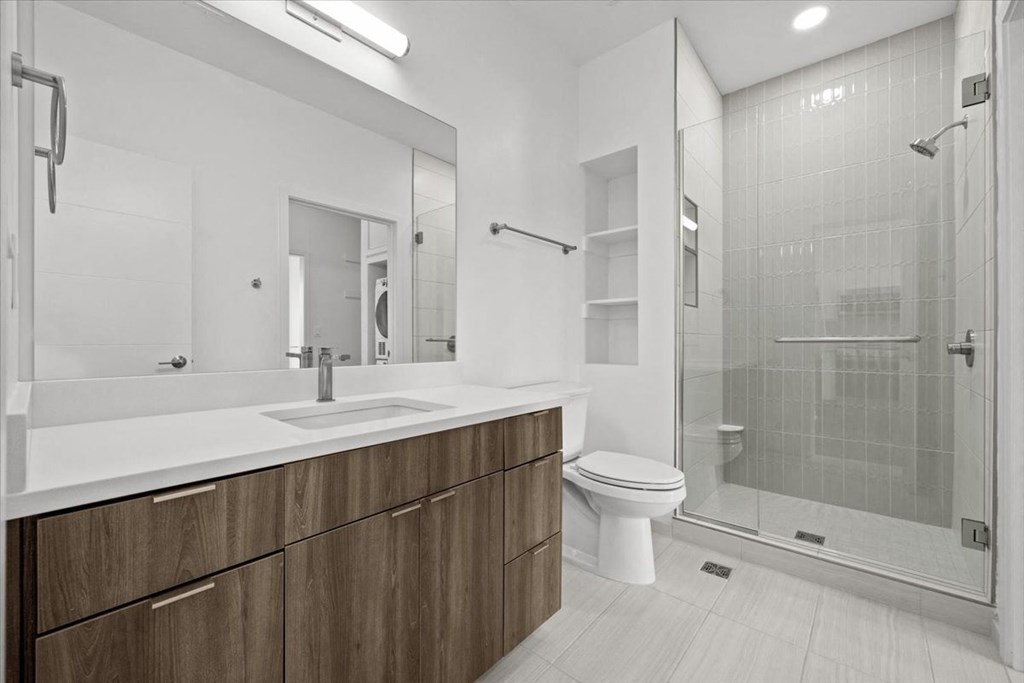 a bathroom with a toilet sink and a shower at Sky On Main Apartments, Missouri, 64105