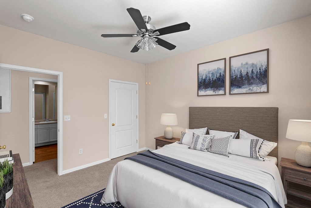 a bedroom with a large bed and a ceiling fan at Creekside, Kansas, 66213