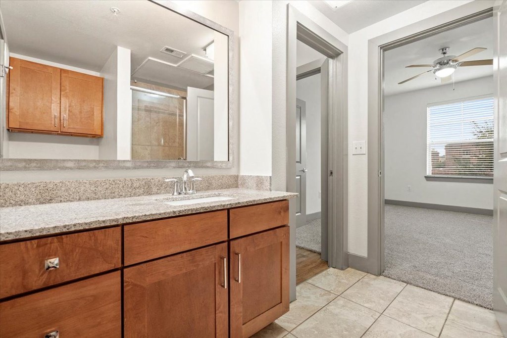 Bathroom with a mirror at Ovation at Lewisville Apartments, Lewisville, 75067