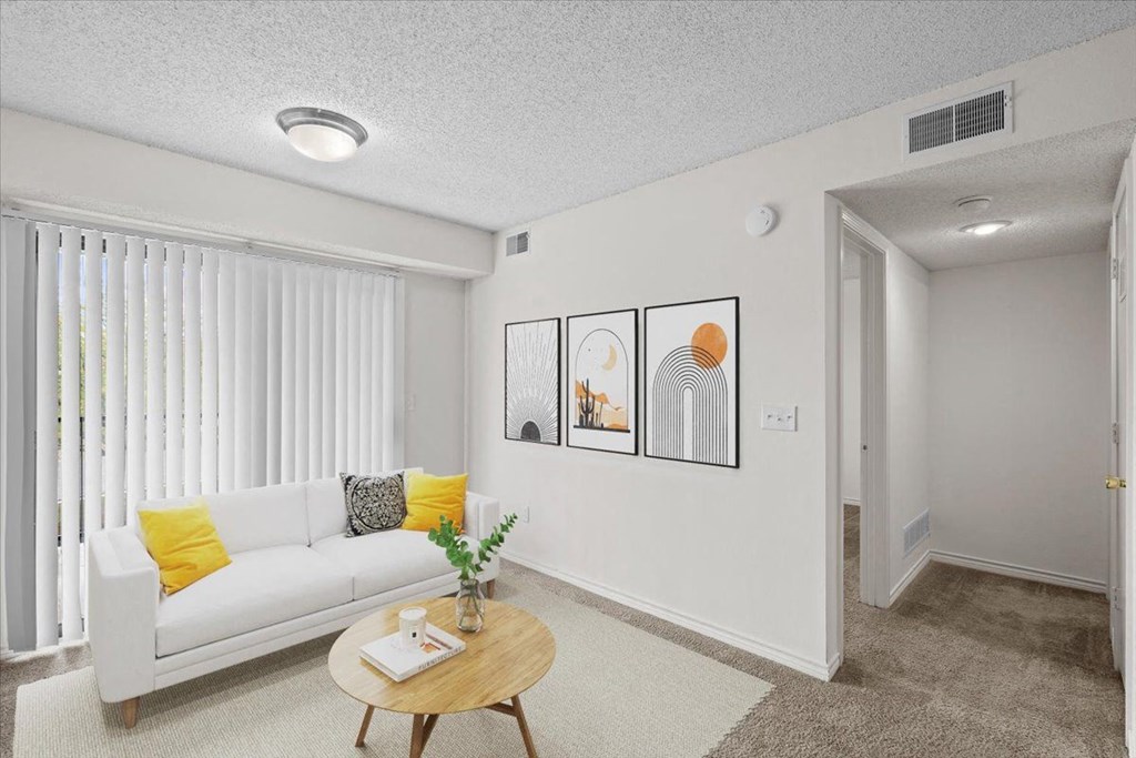 a living room with a couch and a coffee table at Wind River Lodge, Kansas