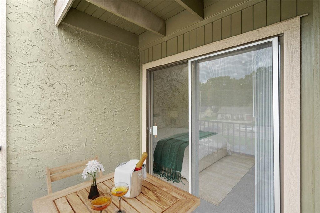 Balcony and oversized windows at Bremerton Park Apartment Homes , Kansas