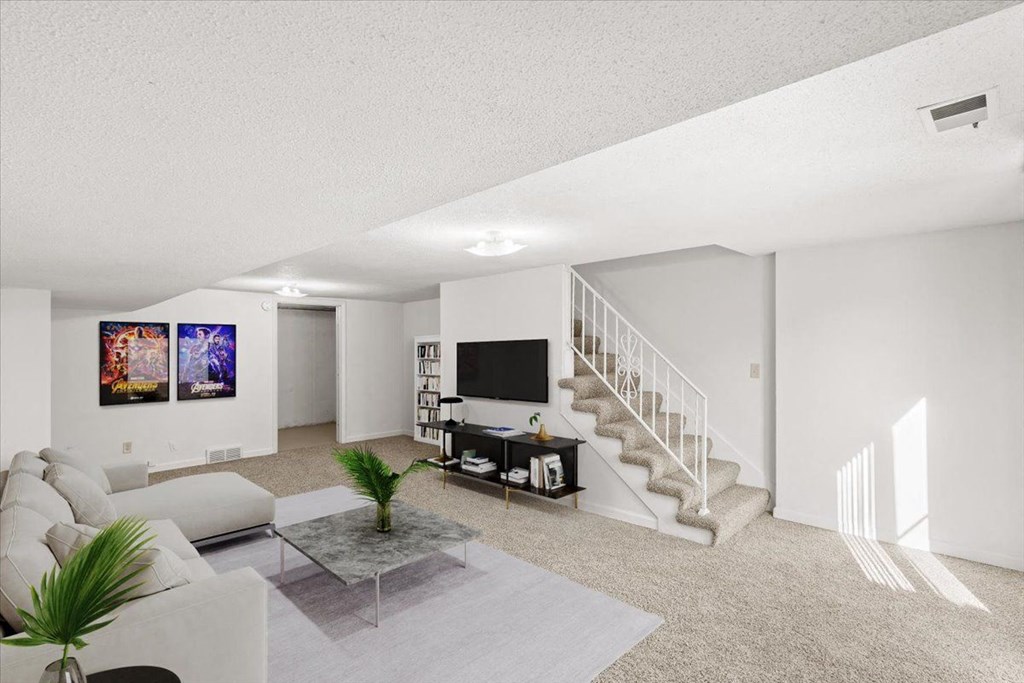 a living room with a couch and a tv