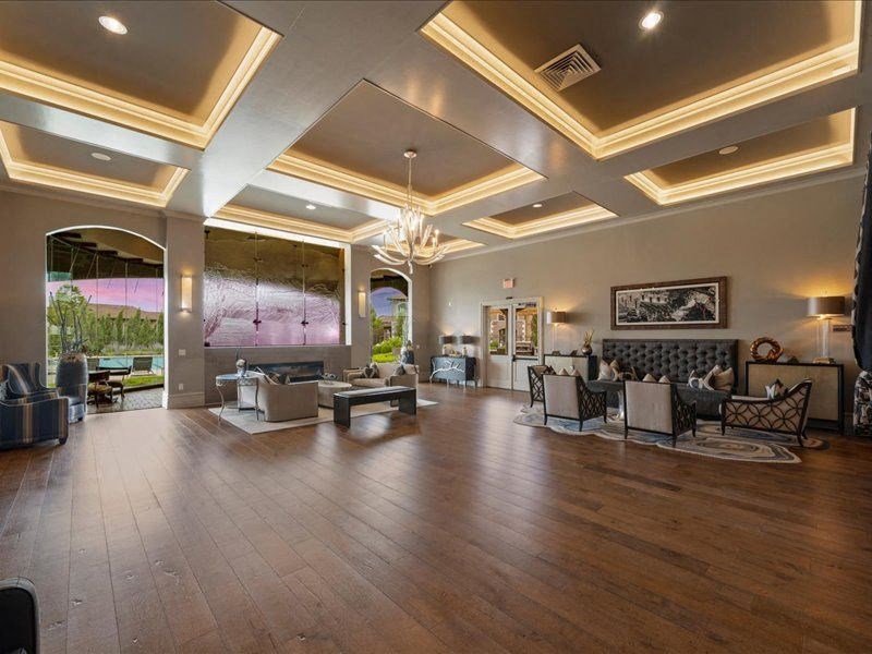 a large living room with furniture and a large window