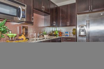 kitchen with stainless steel appliances A at  Cypress at Lewisville Apartments , Lewisville,Texas