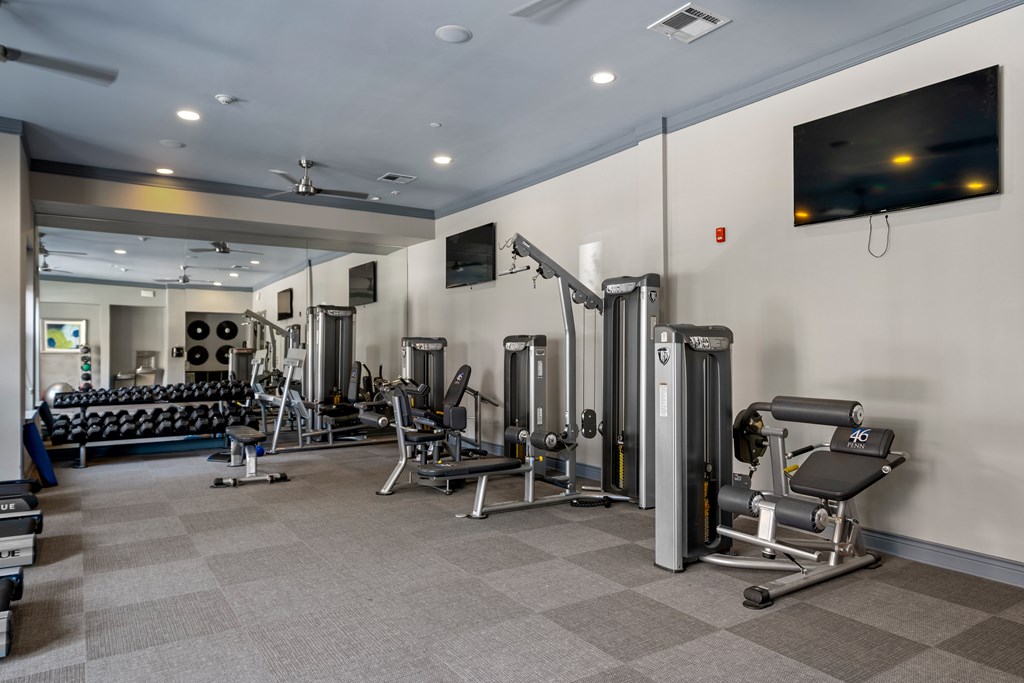 A well-equipped gym with a variety of machines and weights. at 46 Penn Apartment Homes, Kansas City, Missouri