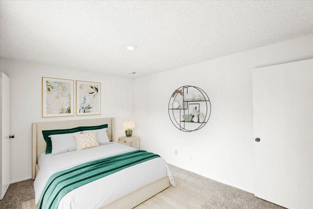 Bedroom with paintings at Bremerton Park Apartments Homes in Prairie Village, Kansas