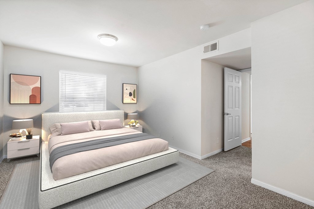 a bedroom with a bed and two night standsat Stonebriar Woods Apartments, Overland Park, Kansas