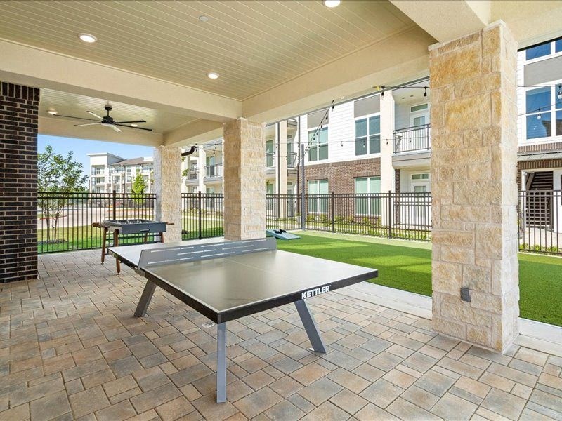 a patio with a ping pong table
