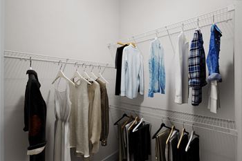 Clothes hanging on a clothes rack.