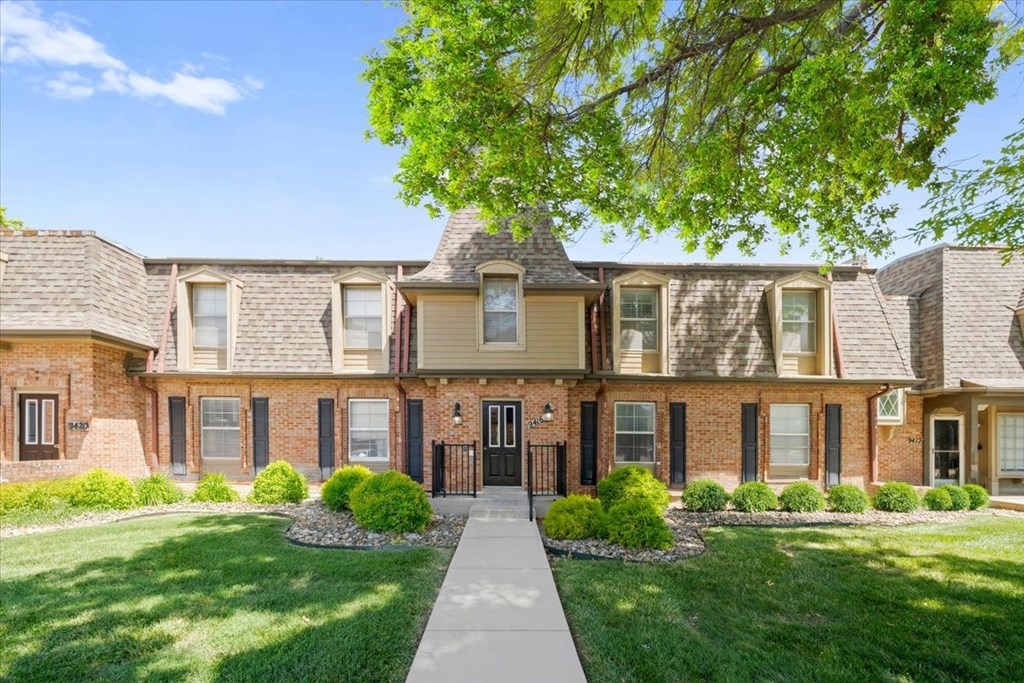 Property exterior with front yard  at Louisburg Square Apartments & Townhomes, Kansas