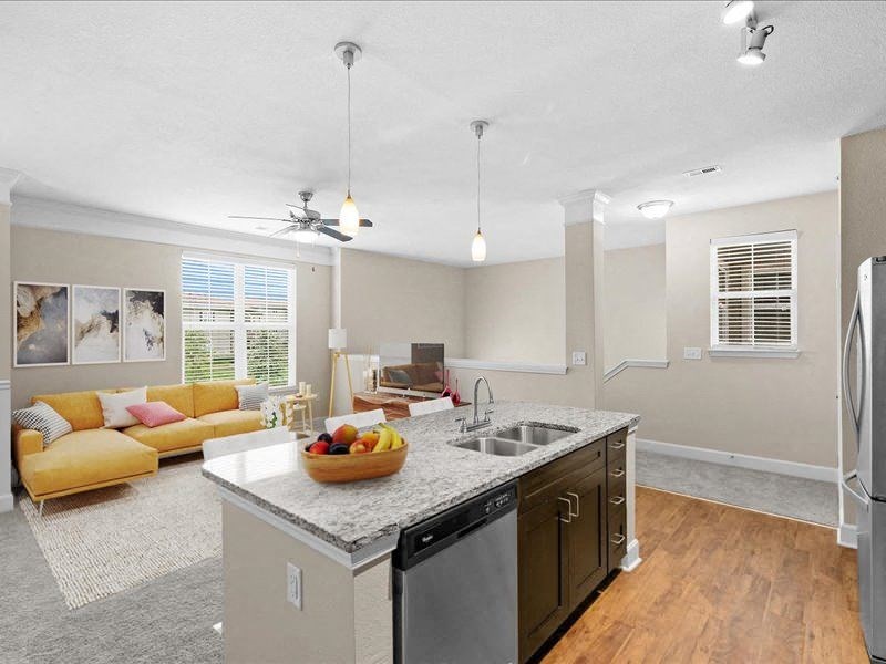a kitchen and living room with a counter top