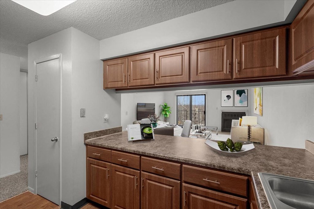 a kitchen with wooden cabinets and a counter top