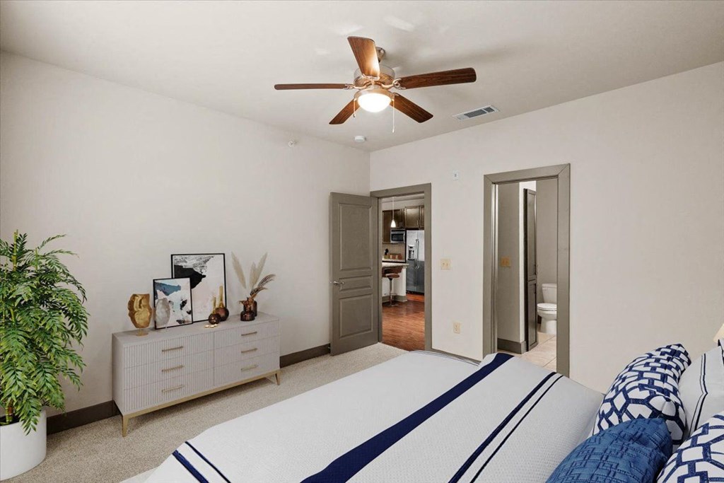 a bedroom with a bed and a ceiling fan at Cypress at Lewisville Apartment Homes, Texas, 75067