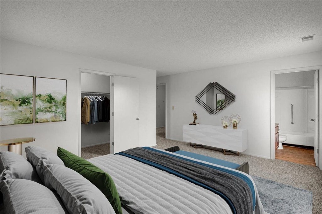 a bedroom with a large bed and a closet