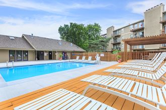 Swimming pool patio with view at Cloverset Valley Apartments, Kansas City, MO, 64114 - Photo Gallery 3