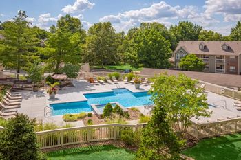 Lush green surroundings and pool view at Stonebriar Apartments, Overland Park, 66213