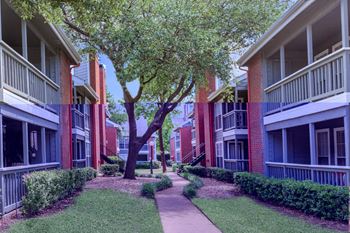 walking path between apartment buildings  at Pear Ridge, Dallas, Texas
