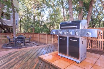grill on deck patio  at Creekview Apartment Homes, Dallas, TX, 75254