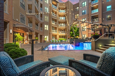 A large building with a pool in the middle of a courtyard.