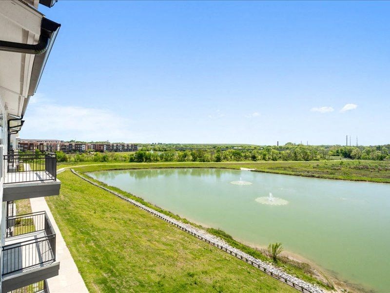 a view of a body of water from a balcony of a building