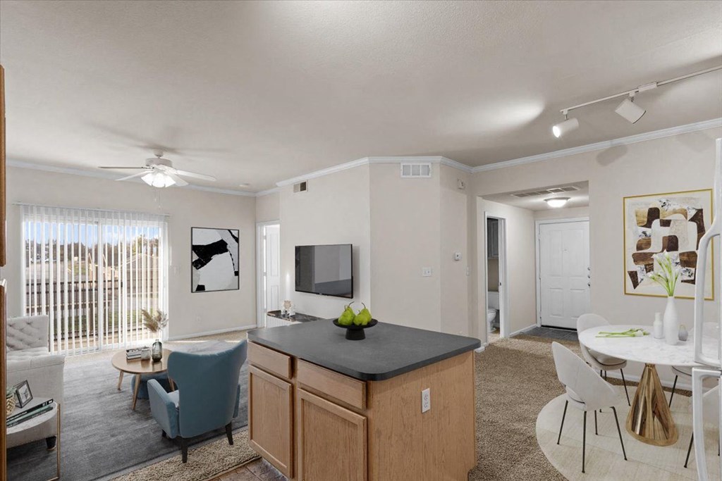 our apartments offer a living room and dining room with a tv at Stonepost Lakeside, Olathe, KS