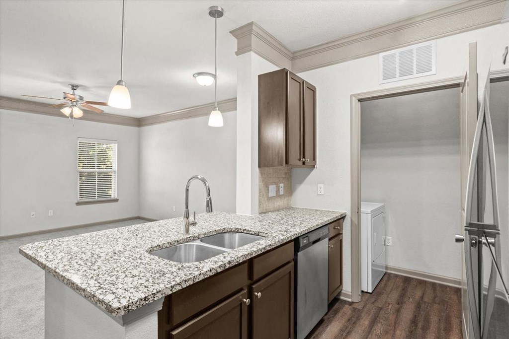 a kitchen with a sink and a dishwasher