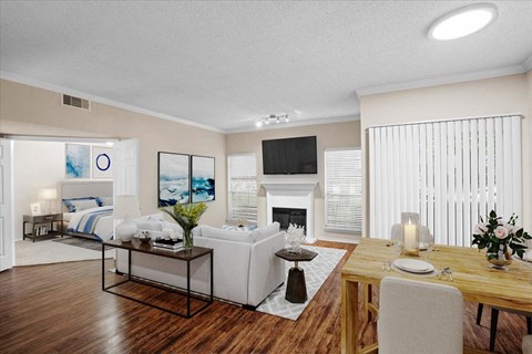 a living room with a couch a table and a fireplace at Creekview Apartment Homes, Texas, 75254