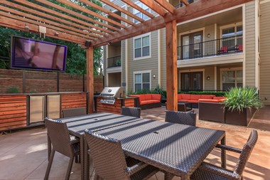 Outdoor seating chair and tableat West 39th Street Apartments, Missouri - Photo Gallery 2