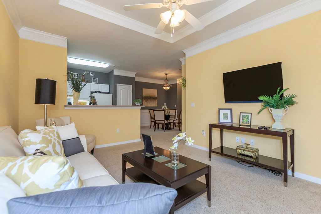 Living room with sofa and tv at Wynnewood Farms Apartments, Overland Park, 66209