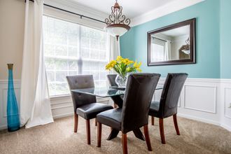 Dining table and chair at Wynnewood Farms Apartments, Overland Park