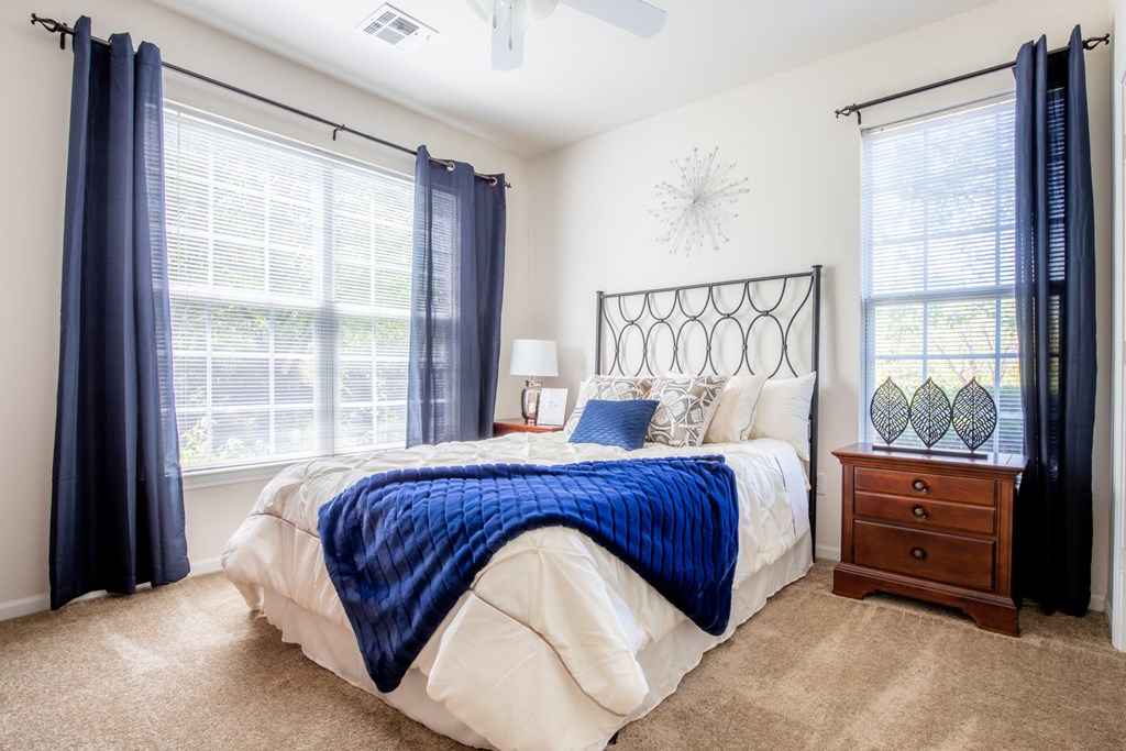 Bed in bedroom at Wynnewood Farms Apartments, Kansas