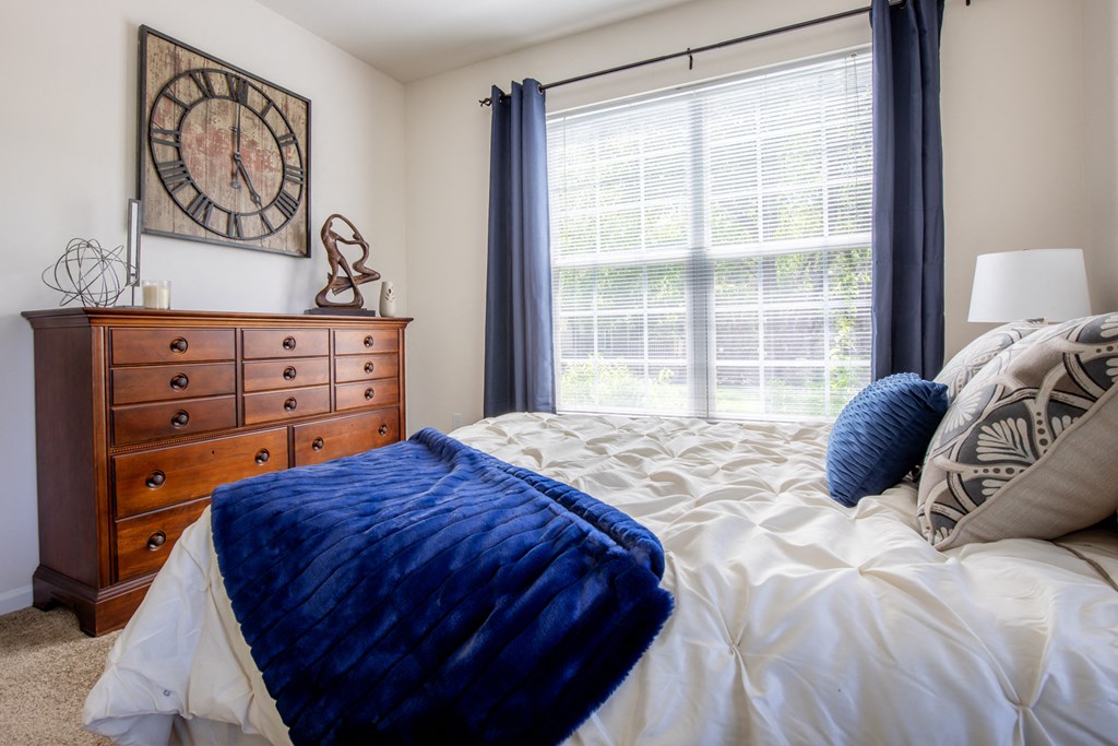Bed in bedroom and cupboard at Wynnewood Farms Apartments, Kansas, 66209