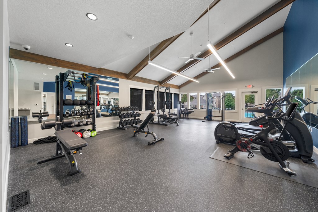 Wind River Lodge Fitness Center a gym with weights and cardio equipment on the floor and glass walls