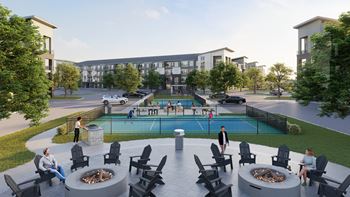 an aerial view of a pickleball courts and fire pits with an apartment building in the background