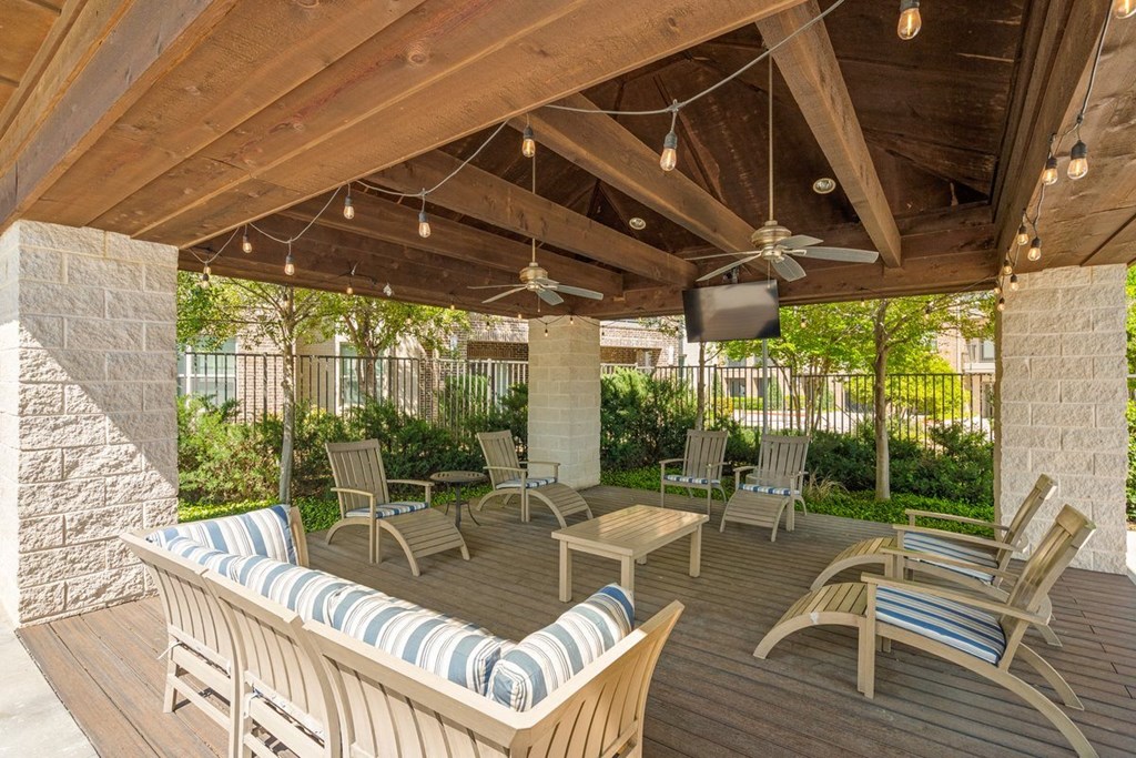 Covered seating area with chairs at Ovation at Lewisville Apartment Homes, Texas , 75067