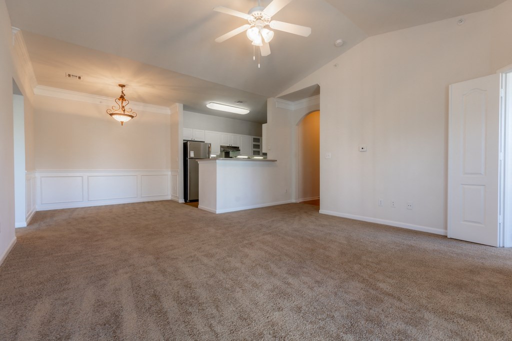 Living room with window light and ceiling fan and lights1 at Wynnewood Farms Apartments, Overland Park, 66209